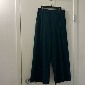 Pleated ankle length wide trousers in emerald green. Size EU34/US2. Like new.